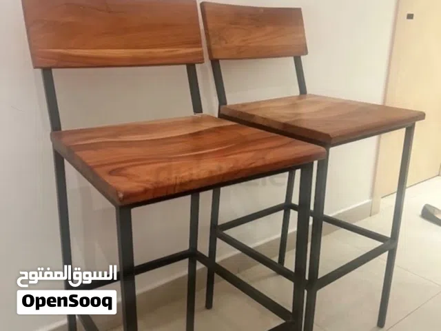 2 bar wood stool chairs. Bought them and never used them at all sticker still on them