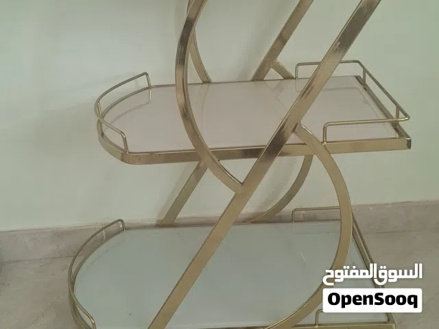 ترولي زجاجي ذهبي