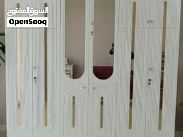 دولاب ماليزي فاخر بسعر عرطة تصميم عصري راقٍ مع مرايا طولية وزخارف هندسية فخمة تضيف لمسة ملكية لغرفتك