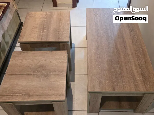 one wooden coffee table + two wooden end table طاولة وسط خشبية + 2 طاولات جانبية خشب