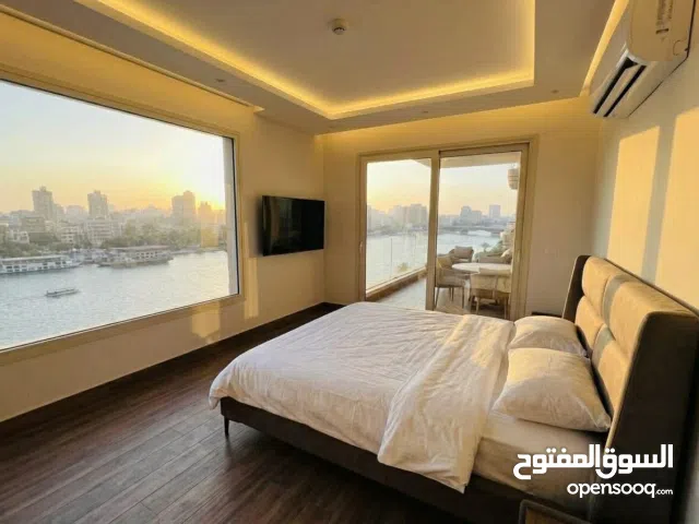 أمتلك وحدة فندقية مفروشة ومتأجرالك فـ الشهر بـ 119ألف بعقد موثق 100% فيو خيالي عـ النيل والاهرامات