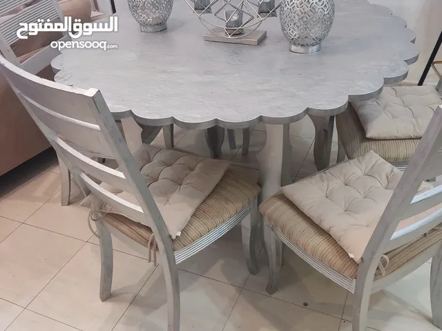 metal table with 6 wooden chairs