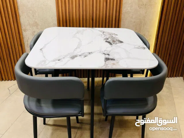 ميز طعام 4 كرسي سطح رخام مزجج