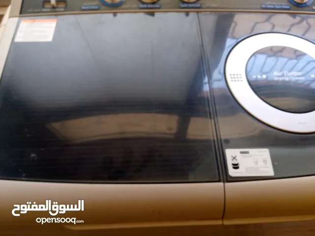 غسالة نوع سامسونج 12 كليو حوضين ملفات انحاس بحاله جيده جدا لون سلفر حجم كبير وثقل