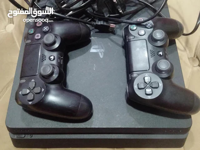 playstation 4 slim with 2 controllers