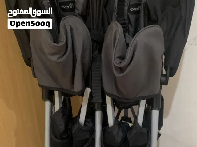 عربة أطفال توأم