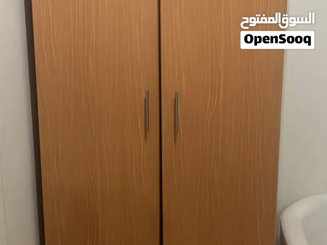 Single bed and cupboard