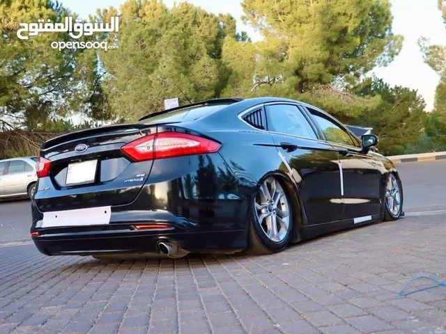 فورد فيوجن للبيع مستعملة بحالة الوكالة يوجد عليها إضافات