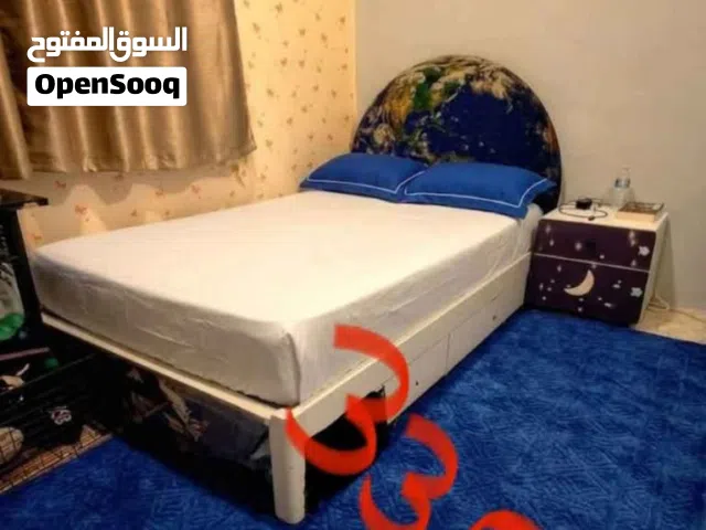 Bed with mattress and side table