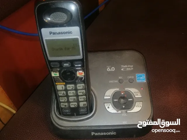 تلفون ارضي Panasonic و مقوي شبكة و راوتر Netgear