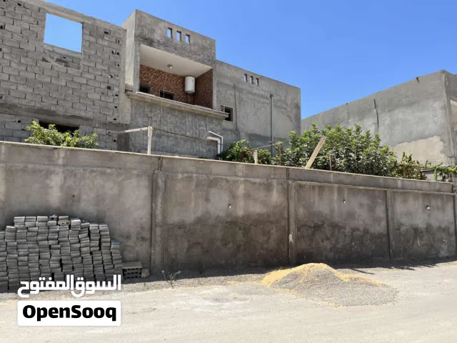 أرض 500 متر مقام عليها منزل دورين كاملات   ومنزل هيكل مسقف قيد الانشاء  جنان دور الداير  واجهة 27متر