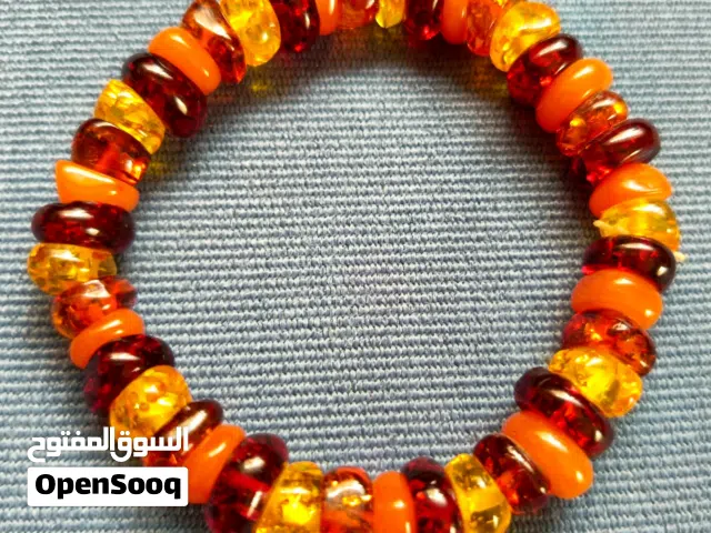 اسوارة كهرمان احمر حقيقي 4 درجات cherry amber حجر كريم قياس مرن