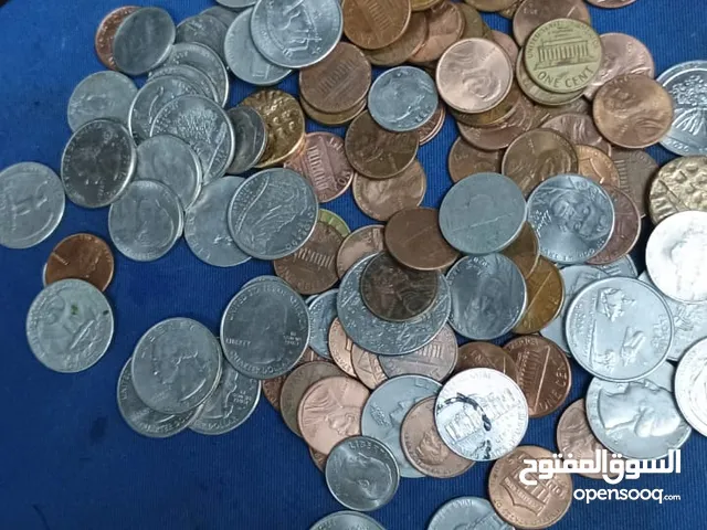 عملات معدنية متنوعة.. منها امريكية.. Various coins, including American ones.