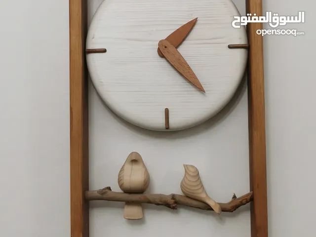 ساعة حائط مصنوعة مم خشب الزان القوي