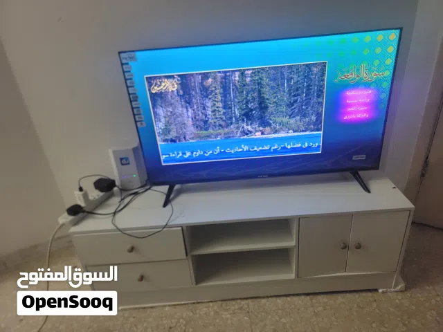 تليفزيون 40 بوصه جديد وطاولة جديدة