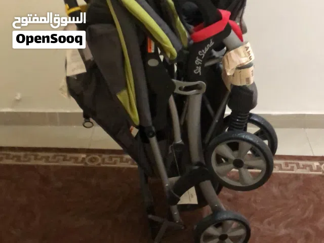 عربة أطفال توأم