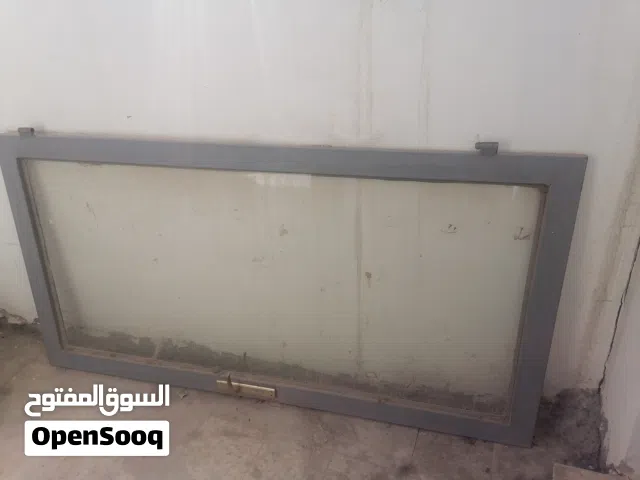 باب اطار حديد زجاج مع زرفيل