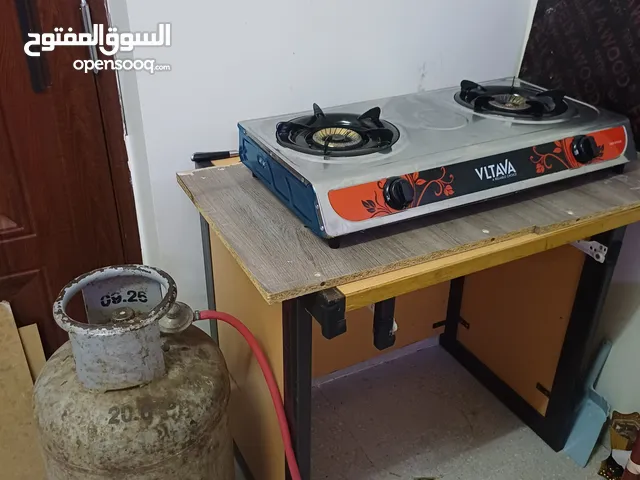 Gas cylinder + cooker with regulator and hose and table OMR 30