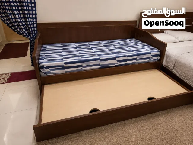 Wooden Single Bed with Pull-Out Trundle and Storage