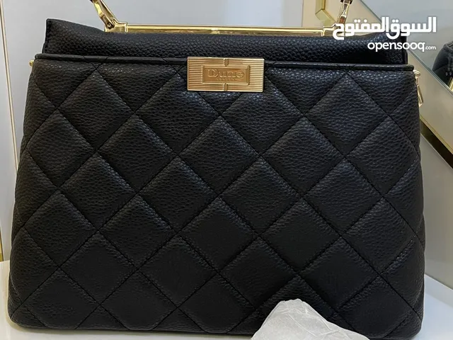 حقيبة أصليه من ماركة ديون لون اسود حجم وسط جميله تناسب كل شئ الأذواق يوجد بها حزام طويل وقصير