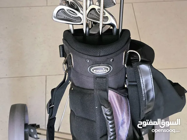 Set of Golf Clubs with rolling trolley and practice carpet