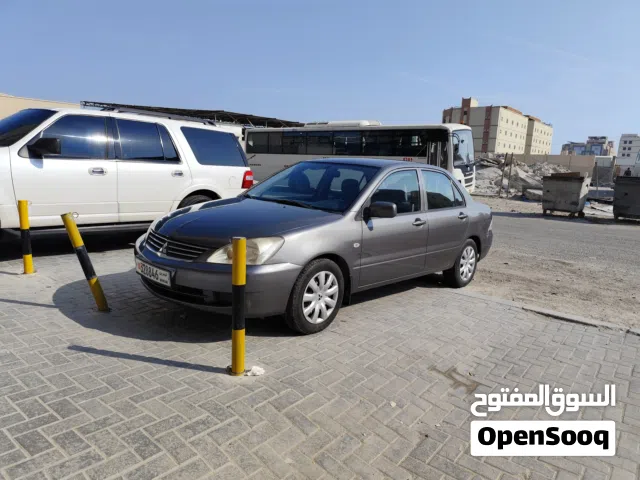 Mitsubishi Lancer 2012 GLX – Well maintained and in good condition. Color: Dark Grey