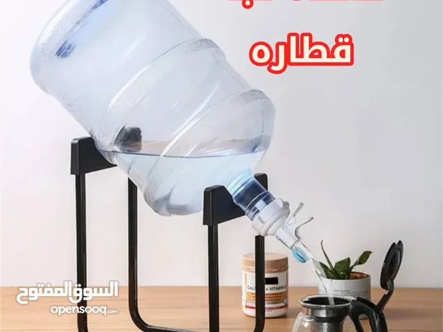 *قاعدة حديدية مبتكرة مصممة لحمل جالون (دبة