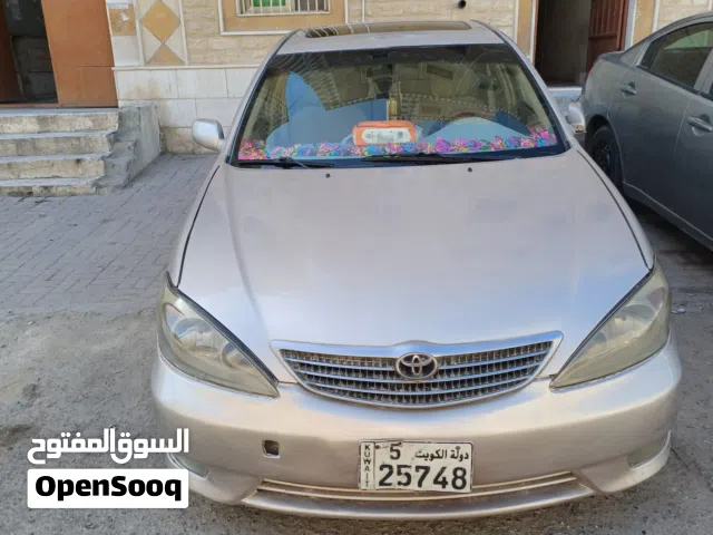 تويوتا كامري 2004 خليجي مستعمل لون برونزي بداخل بيج مع ميزات كاملة الاتصال على الرقم موجود بالاسفل