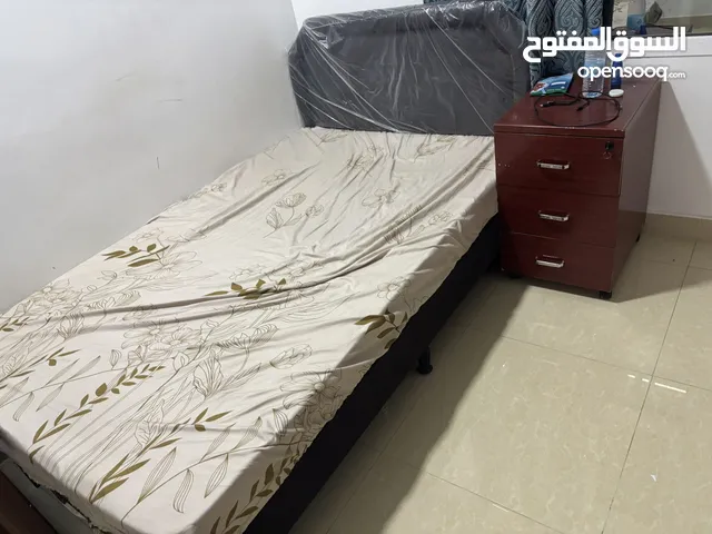 Bed and cot with side table available in mawelah