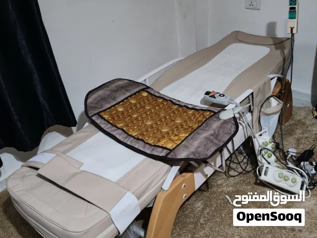 سرير مساج بواسطة احجار اليشم