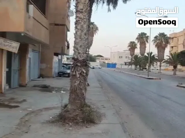 شقة للبيع في منطقة تاجوراء حي الضواحي عمارات البحوث بالقرب من الإشارة الضوئية