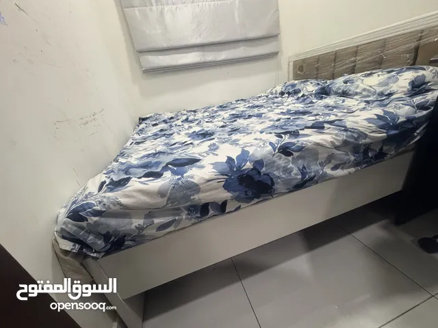 King sized bed with mattress available for sale