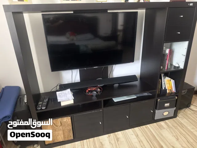 Samsung 46 inches TV Cabinet mounted TV along with the cabinet and Samsung Sound Bar (with Woofer)