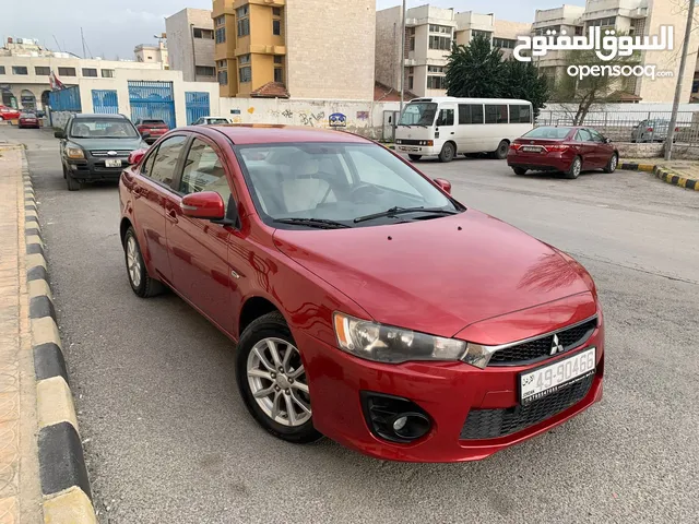ميتسوبيشي لانسر فراشه 2017 2000cc محرك فل نضافه للبيع بسعر 9250 لون احمر دم الغزال من الداخل بيج