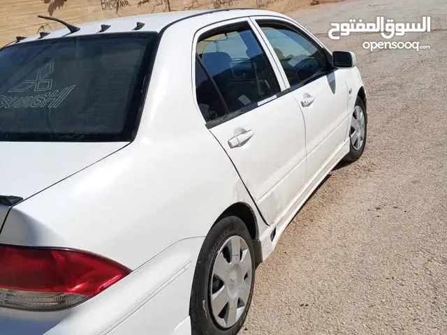 لانسر للبيع موديل 2003 متور 1300 جير عادي صلاة النبي ولا بحاجه لاشي ترخيص لغاية 25 8. فحص خالي قص