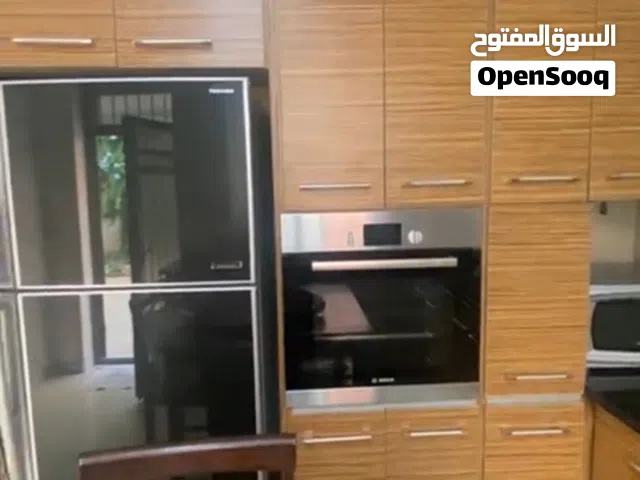 شقة شبه ارضي مفروشة في دير غبار للإيجار مع حديقة و ساحات خارجية