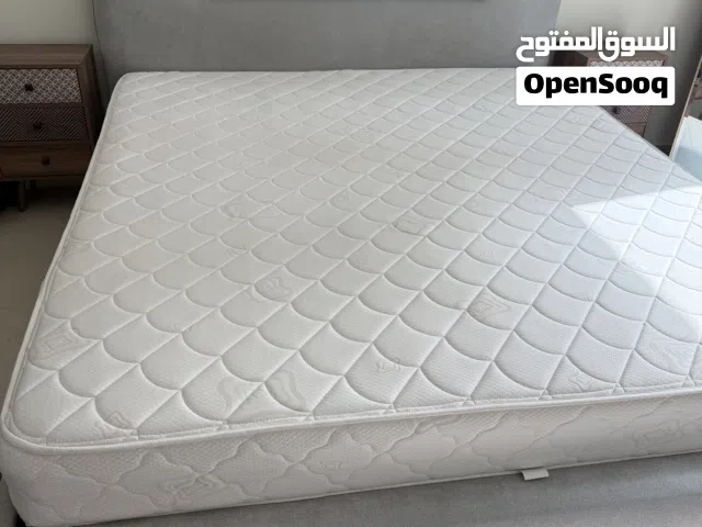 King size bed with mattress and two night stands