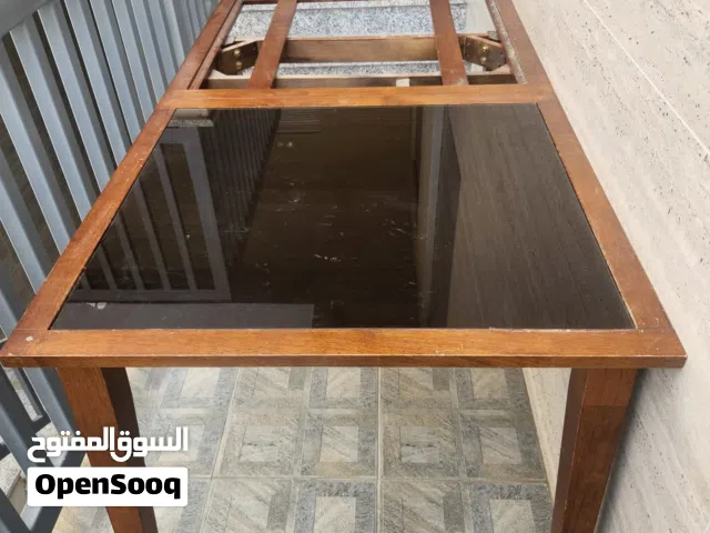 طاولة خشب مع لوح زجاج واحد فقط wooden diner table with only one glass tile