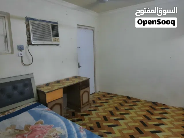 small room with attached bathroom and kitchen