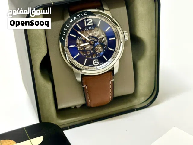 • النوع: ساعة ميكانيكية أوتوماتيك (Skeleton – يظهر جزء من الماكينة من الداخل).