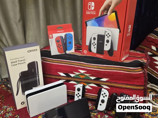 Nintendo Switch OLED نينتندو سويتش اوليد أبيض مع 4 ألعاب أصلية + يدات إضافية + حقيبة + الكرتون
