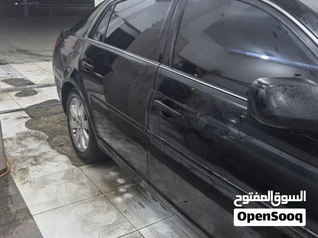 تويوتا أفالون 6 سلندر اللون أسود الداخليه بيج