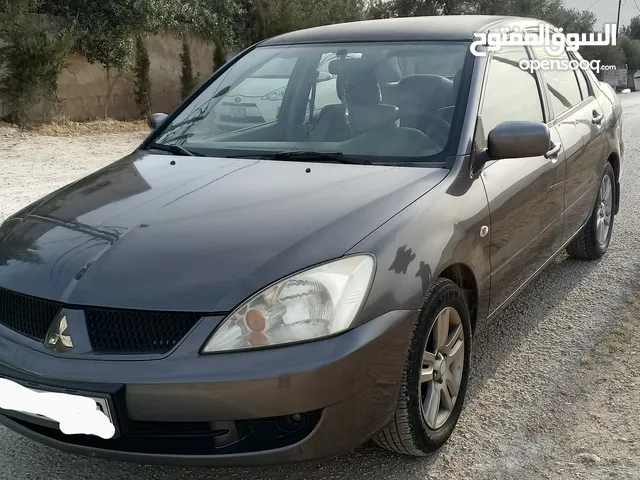 للبيع كاش ميتسوبيشي لانسر GLX لون فيراني موديل 2011 وارد الشركة ماتور 1600 اصلي قير توب ترونك