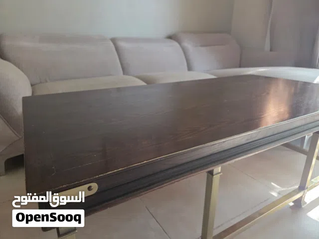Solid wood and brass coffee table from homecenter.