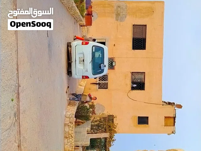 منزل طابقين للبيع في منطقة الذهبيه الغربية اللسين  مساحه الارض دونم ونصف مشجره 30شجرة زيتون 6ليمون