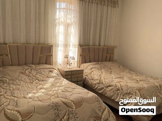غرفه نوم اثنين أسرة