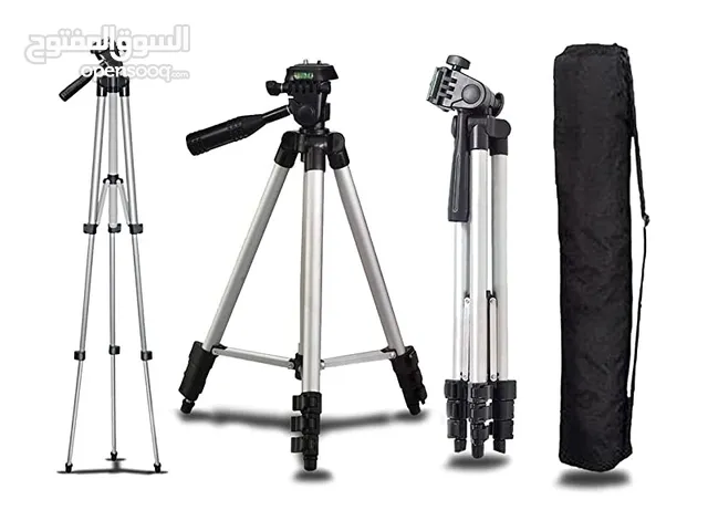 A lightweight aluminum tripod for cameras or phones, extendable and foldable, with a handle for move