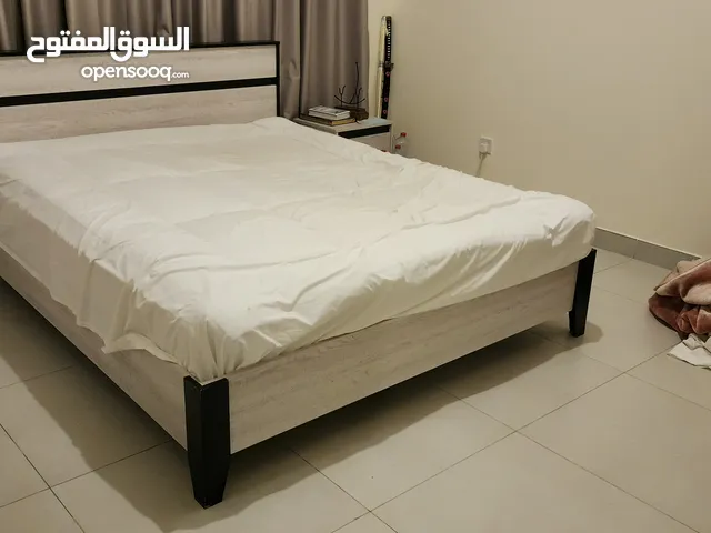 queen-size bed with mattress for sale