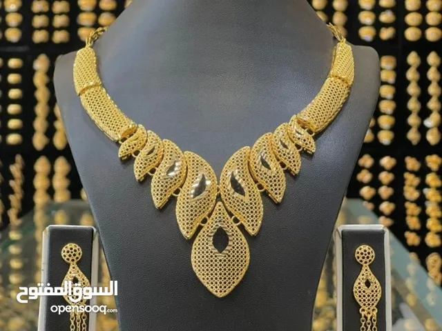 بدلات روعة مطلي بماء الذهب