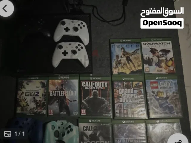 xbox one console + 3 controllers + 10 good as new cds + 2 controller cover...